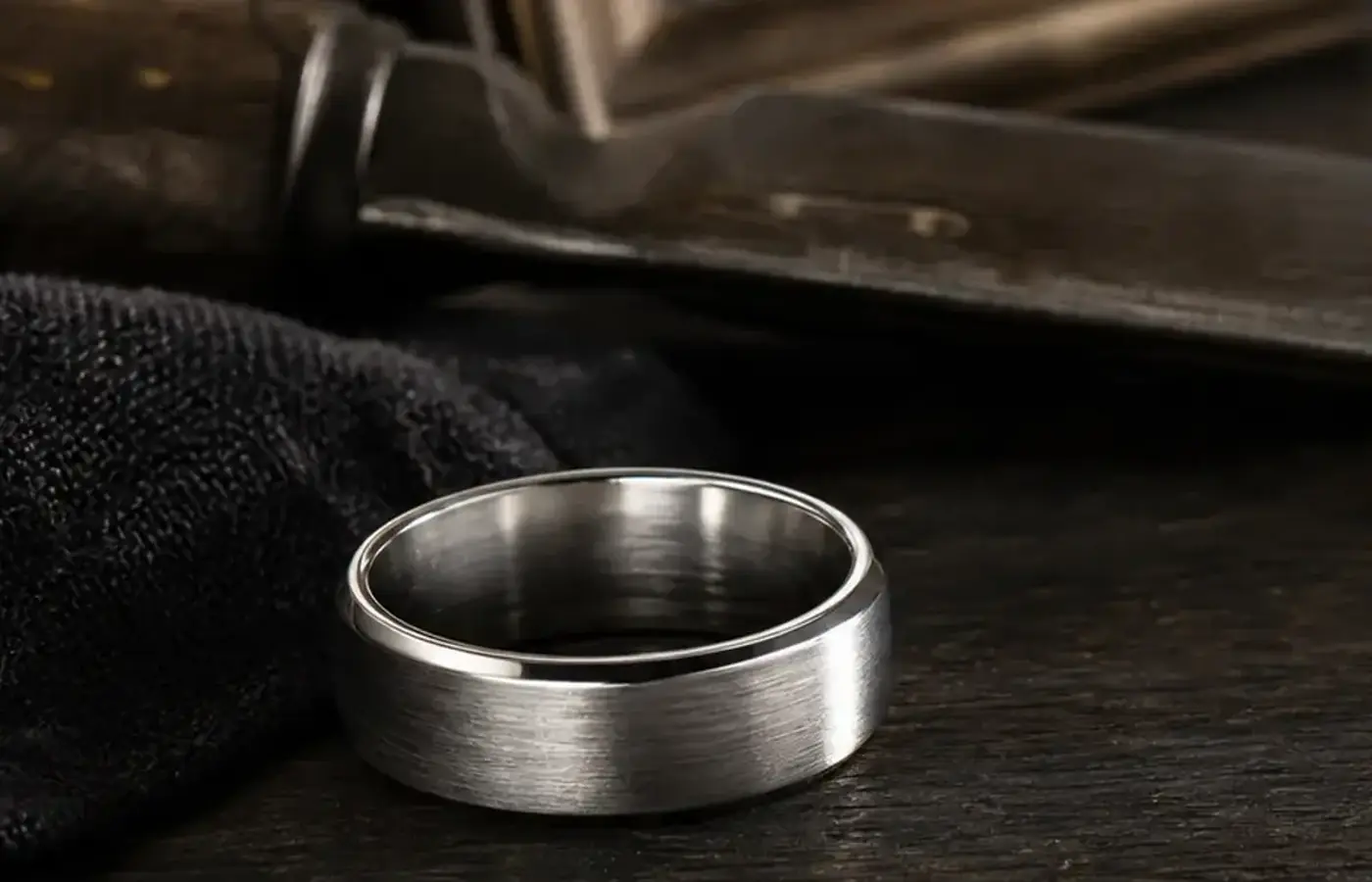 Firefighter Maltese cross memorial ring guide with a brushed silver band, service cross reference, and station number card