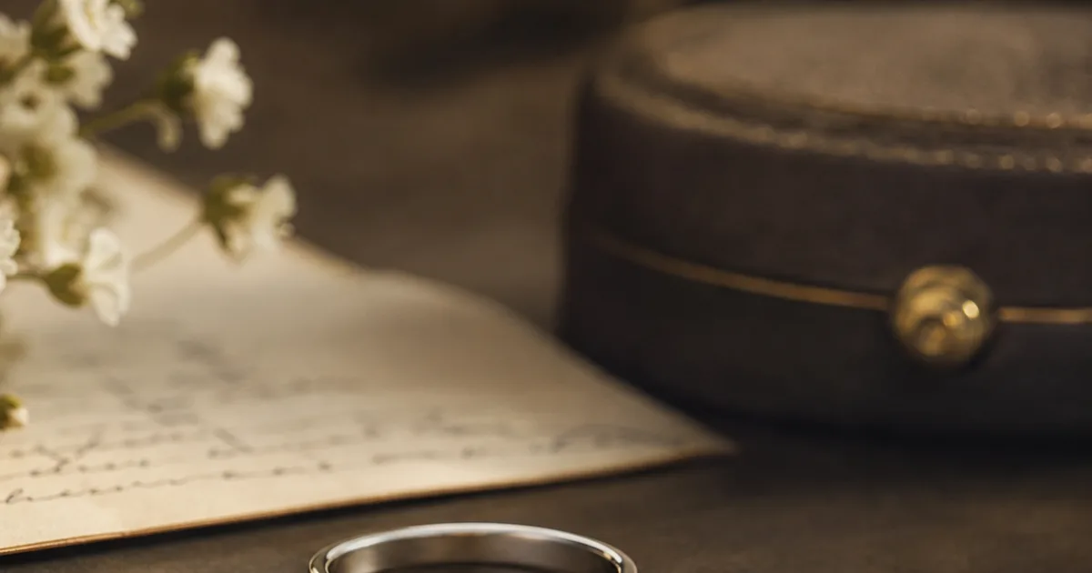 Memorial ring for grandma shown with soft silver styling, handwriting, and flower details
